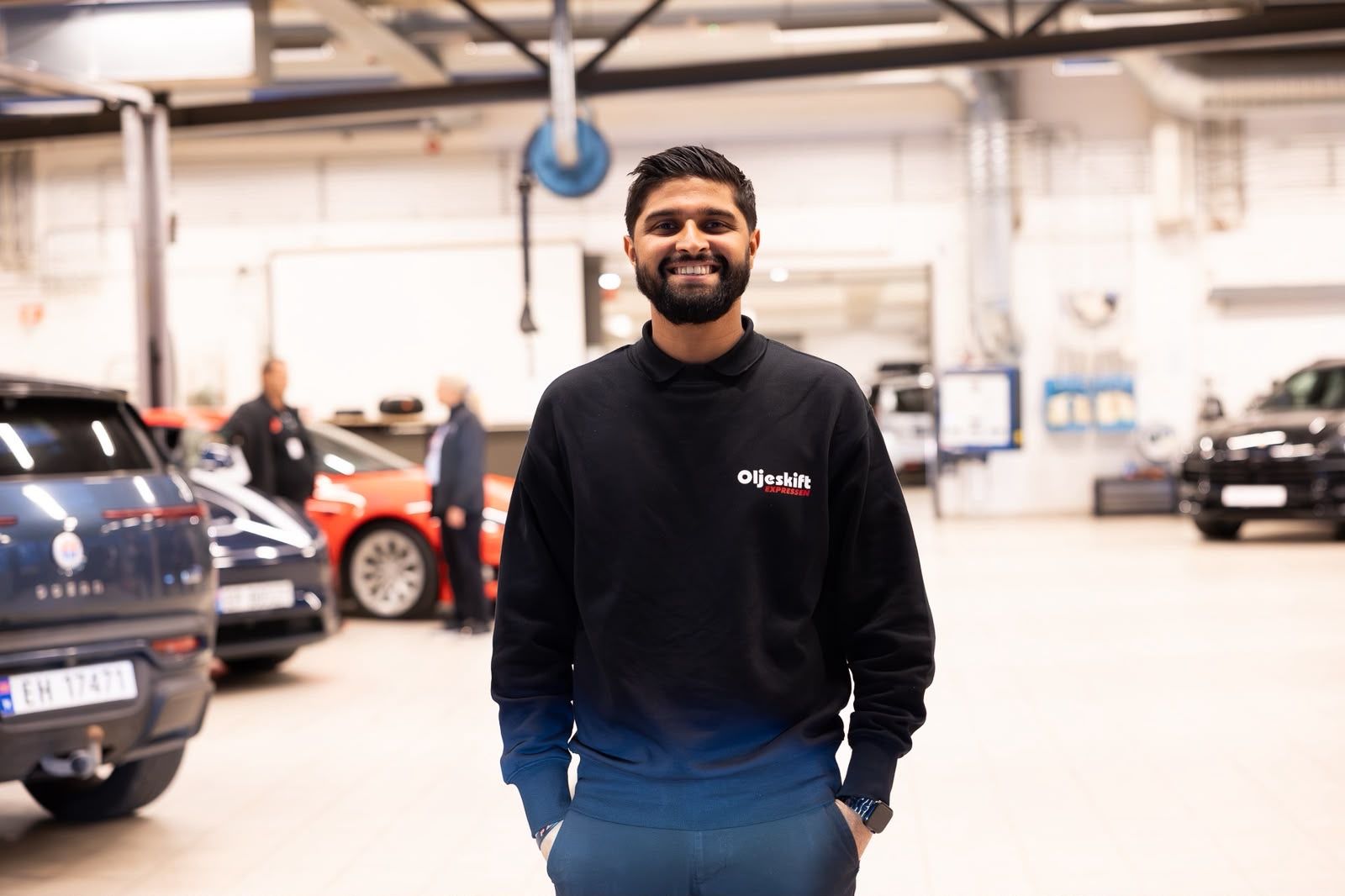 Smiling team member in the workshop hall